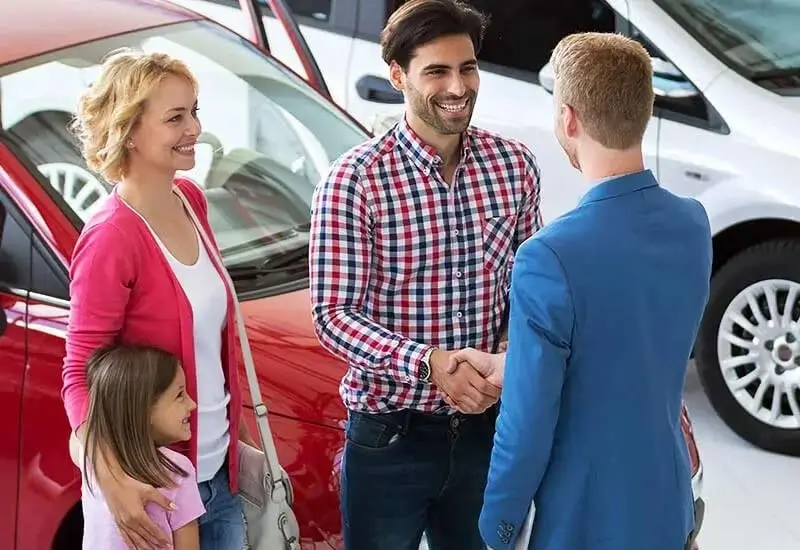 Happy family with their new vehicle from Patterson Kilgore